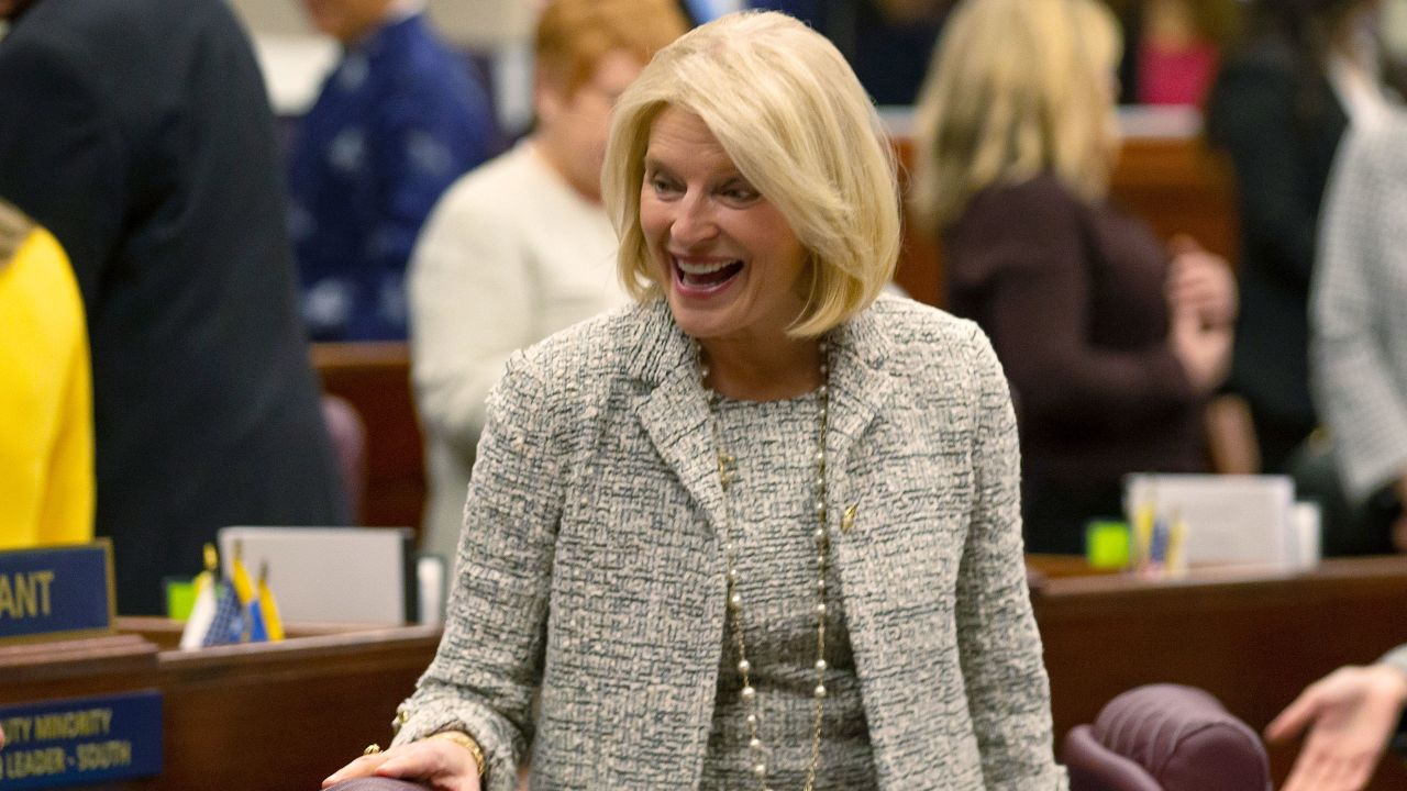 Nevada Republican Assemblywoman Heidi Kasama laughs with lawmakers in Carson City, Nevada, on February 6.