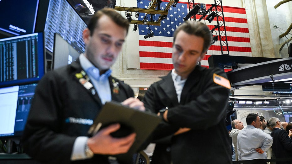 Traders work on the floor of the New York Stock Exchange